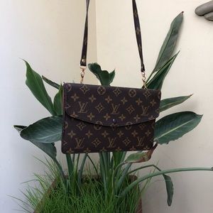 Louis Vuitton clutch purse with strap